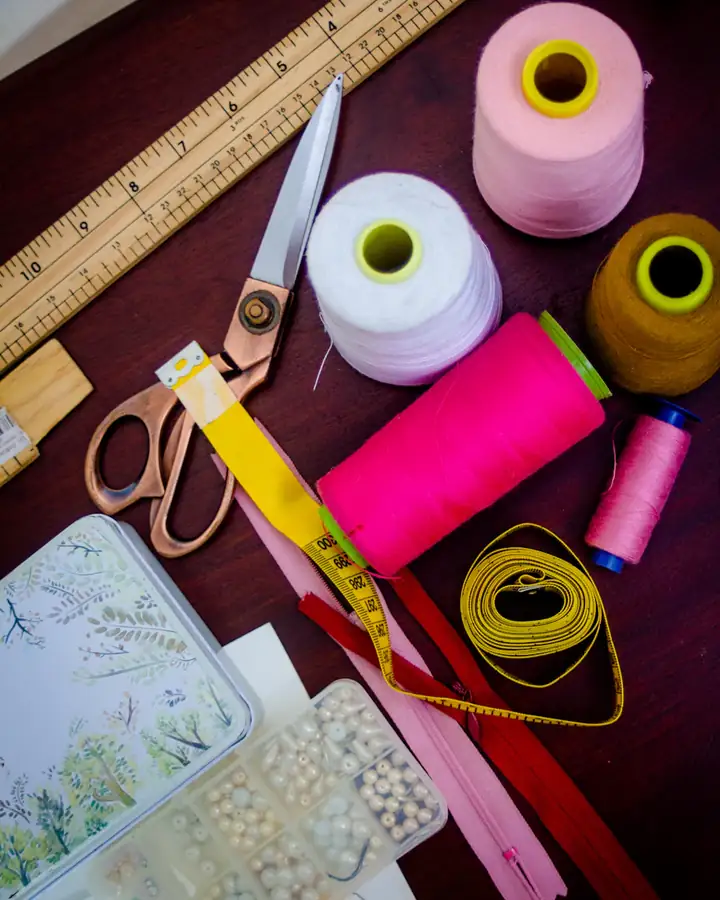 Sewing threads, scissors and tape